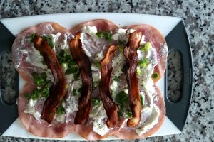 Top with cream cheese, onions, ranch dressing and bacon